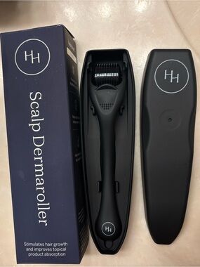 Happy Head scalp dermaroller. New in original box. Comes with case.
